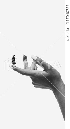 Surreal composition person standing on extended fingertip Surreal composition person standing on extended fingertip 137040728