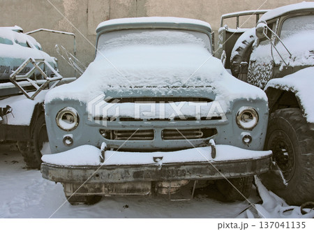 Old car in winter under the snow 137041135