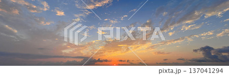 Colorful sky with clouds. Panoramic romantic outdoors scenery cloudscape skyline 137041294