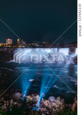 Niagara Falls Night View With Illuminated Waterfall And Light Beams Niagara Falls Night View With Illuminated Waterfall And Light Beams 137042139