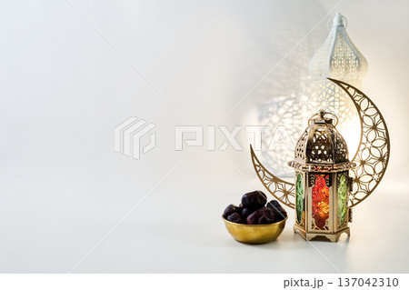 Ramadan kareem celebration with dates and illuminated lantern 137042310
