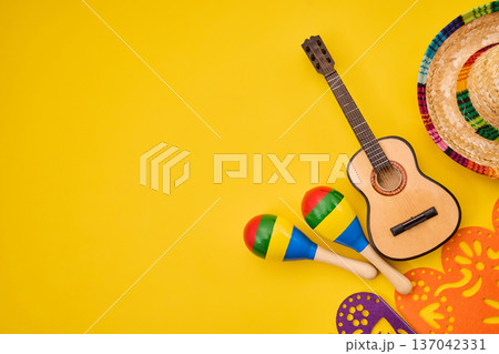 Mexican fiesta items on yellow background celebrating culture Mexican fiesta items on yellow background celebrating culture 137042331