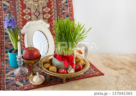 Traditional haft-sin table setting celebrating nowruz spring Traditional haft-sin table setting celebrating nowruz spring 137042365