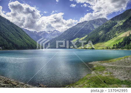 Lake Vernago reflecting the blue sky, Trentino Alto Adige, Italy Lake Vernago reflecting the blue sky, Trentino Alto Adige, Italy 137042995