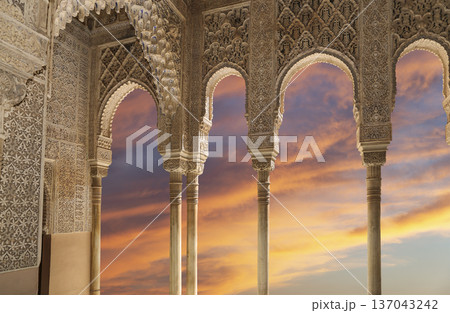 Arches in Islamic (Moorish) style (against the sunset) in Alhambra, Granada, Spain Arches in Islamic (Moorish) style (against the sunset) in Alhambra, Granada, Spain 137043242