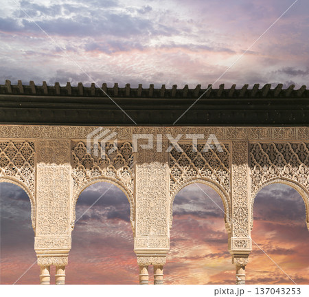 Arches in Islamic (Moorish) style (against the sunset) in Alhambra, Granada, Spain Arches in Islamic (Moorish) style (against the sunset) in Alhambra, Granada, Spain 137043253
