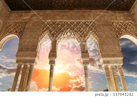 Arches in Islamic (Moorish) style (against the sunset) in Alhambra, Granada, Spain 137043282