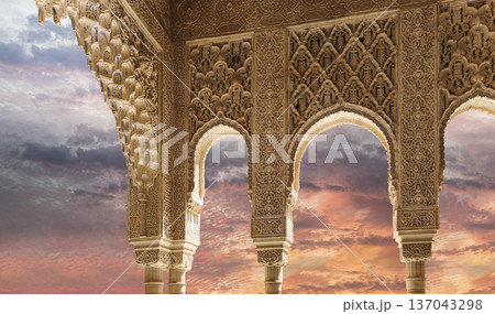 Arches in Islamic (Moorish) style (against the sunset) in Alhambra, Granada, Spain Arches in Islamic (Moorish) style (against the sunset) in Alhambra, Granada, Spain 137043298