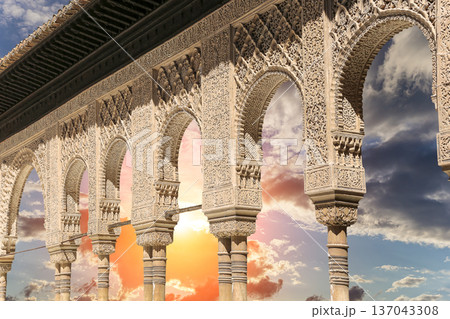 Arches in Islamic (Moorish) style (against the sunset) in Alhambra, Granada, Spain 137043308