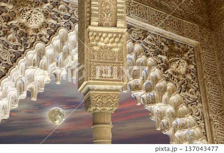 Arches in Islamic (Moorish)  style (against the sunset and supermoon) in Alhambra, Granada, Spain 137043477