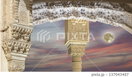 Arches in Islamic (Moorish) style (against the sunset and supermoon) in Alhambra, Granada, Spain Arches in Islamic (Moorish) style (against the sunset and supermoon) in Alhambra, Granada, Spain 137043487