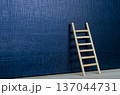 Wooden ladder leaning on deep dark gradient background cover with customizable space for text or ideas 137044731