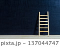 Wooden ladder standing on dark surface with customizable space for text or ideas, illustrating goal setting and personal development concept 137044747