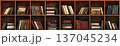 Classic Wooden Bookshelf Filled with Rows of Old Vintage Hardcover Books in Traditional Library 137045234