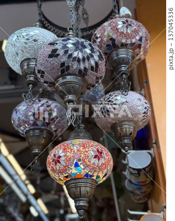 Colorful mosaic Turkish lamps displayed in a market setting for home decor or cultural accent 137045336