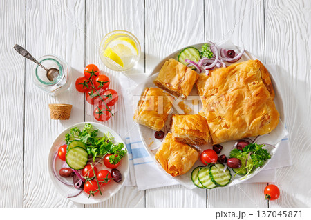 Sliced savory greek meat bougatsa of crispy phyllo pastry 137045871