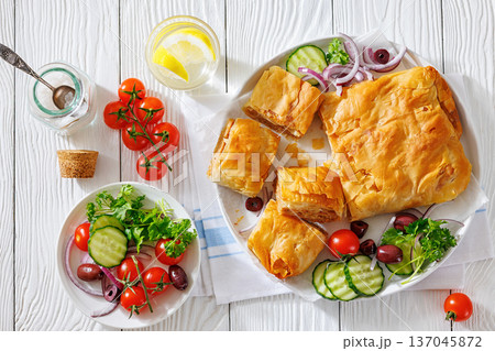 Sliced savory greek meat bougatsa of crispy phyllo pastry 137045872
