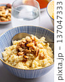 Millet porridge with mixed nuts 137047333