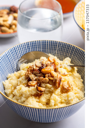Millet porridge with mixed nuts 137047333