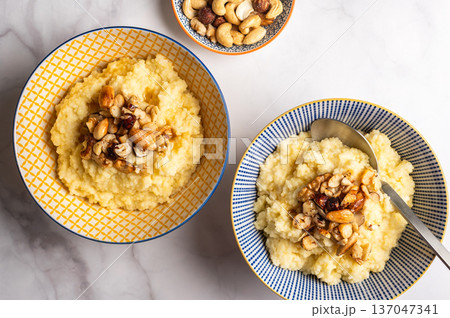 Millet porridge with mixed nuts 137047341