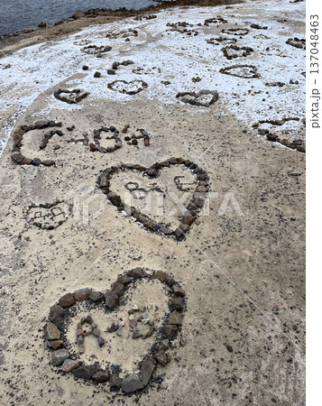 Hearts made of stone on sand Hearts made of stone on sand 137048463