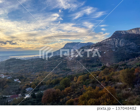 Mountain village in autumn under a blue sky Mountain village in autumn under a blue sky 137048482