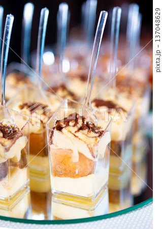 Delicious Mini Desserts Served in Elegant Cups at a Festive Event Delicious Mini Desserts Served in Elegant Cups at a Festive Event 137048629
