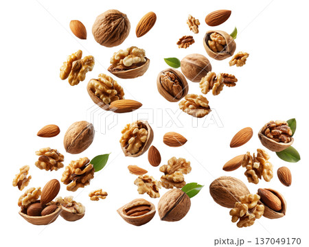 Whole and cracked walnuts with almonds and fresh green leaves, isolated on white transparent background, concept of healthy eating 137049170