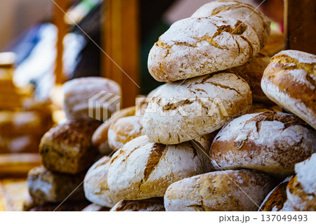 Many rustic fresh bread loaves Many rustic fresh bread loaves 137049493