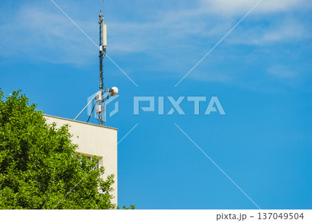 Cellular network antenna against blue sky. Cellular network antenna against blue sky. 137049504