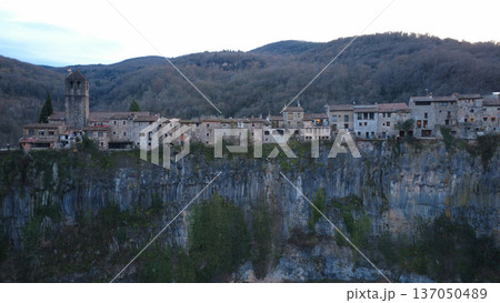 Castellfollit de la Roca on Basalt Cliff in Catalonia Castellfollit de la Roca on Basalt Cliff in Catalonia 137050489