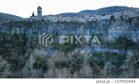Castellfollit de la Roca on Basalt Cliff in Catalonia Castellfollit de la Roca on Basalt Cliff in Catalonia 137050494