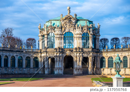 People visit Zwinger Palace in Dresden, Germany during the Christmas season. The complex features beautiful gardens and historic architecture. People visit Zwinger Palace in Dresden, Germany during the Christmas season. The complex features beautiful gardens and historic architecture. 137050768