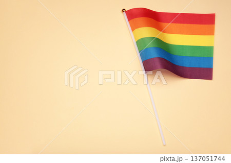 LGBT rainbow flag flat lay on beige background. Space for text 137051744