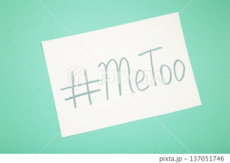 Hashtag METOO inscription white pen on black on mint background 137051746