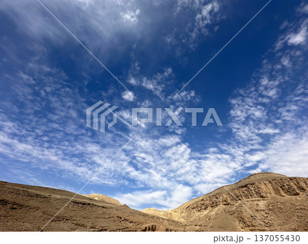Eilat Mountains desert landscape with layered sedimentary cliffs and dramatic sky Eilat Mountains desert landscape with layered sedimentary cliffs and dramatic sky 137055430