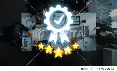 Team Collaboration and Success in Business Meeting with Graphs, Charts, and Five-Star Rating Symbol Overhead for Professional Growth and Achievement. Raster Team Collaboration and Success in Business Meeting with Graphs, Charts, and Five-Star Rating Symbol Overhead for Professional Growth and Achievement. Raster 137055618