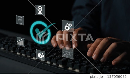 Hands Typing on Keyboard with Digital Interface Icons Representing Checkmarks, Settings, Awards, and Data Analysis for Business Technology Concepts Gluon 137056083