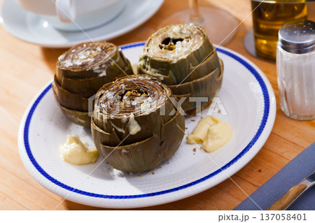 Delicious steamed artichoke Delicious steamed artichoke 137058401
