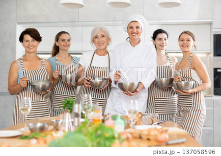Final lesson, general shot of participants culinary master class show together with chef mentor 137058596