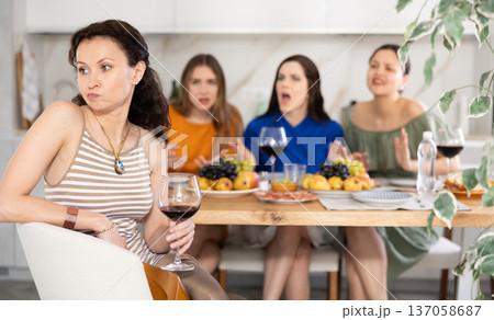 Female friends during family quarrel accuse Caucasian woman Female friends during family quarrel accuse Caucasian woman 137058687