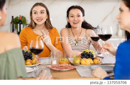 Female friends having fun at intimate house party 137058706