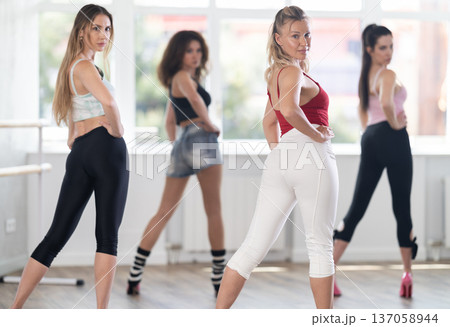 Adult woman dancing high heels in group 137058944