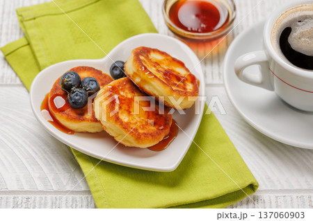 Homemade pancakes with blueberries and syrup Homemade pancakes with blueberries and syrup 137060903