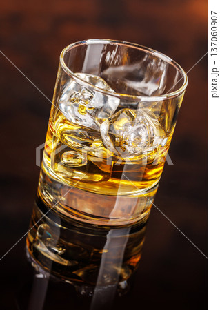 Glass of whiskey with ice 137060907