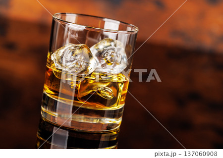 Glass of whiskey with ice 137060908