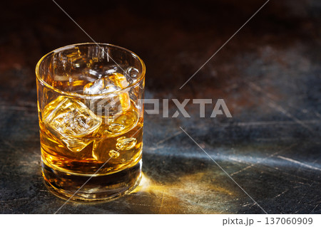 Glass of whiskey with ice 137060909