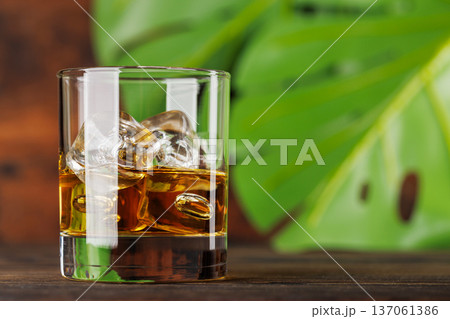 Glass of whiskey with ice 137061386