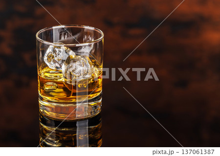 Glass of whiskey with ice 137061387