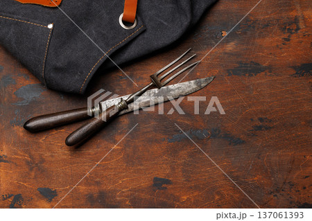 Meat cooking utensils on wooden table 137061393